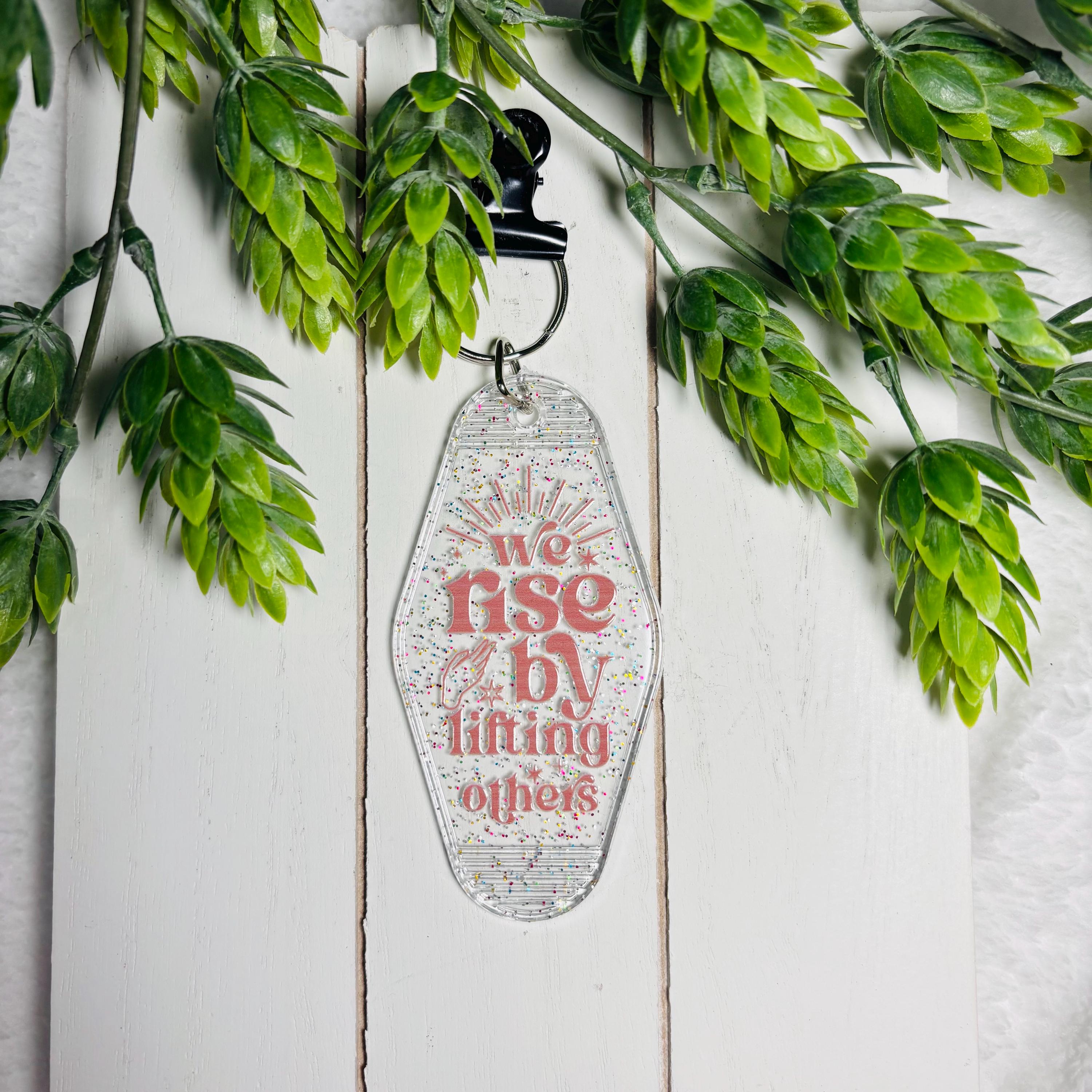 We Rise by Lifting Others Motel Keychain – Glitter Retro Key Tag for Kindness & Positivity